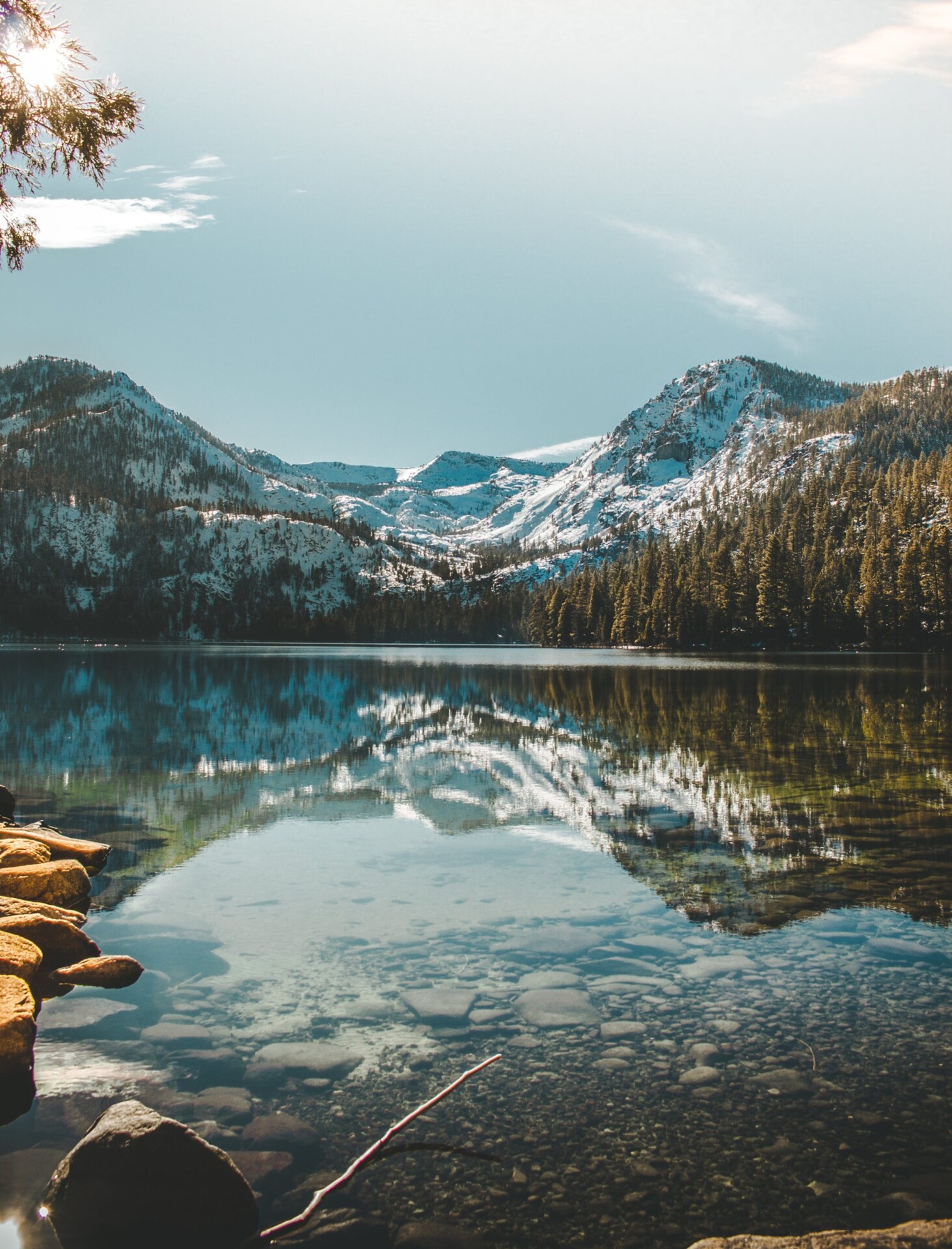 Calm alpine lake reflecting the Sierra near South Lake Tahoe in summer