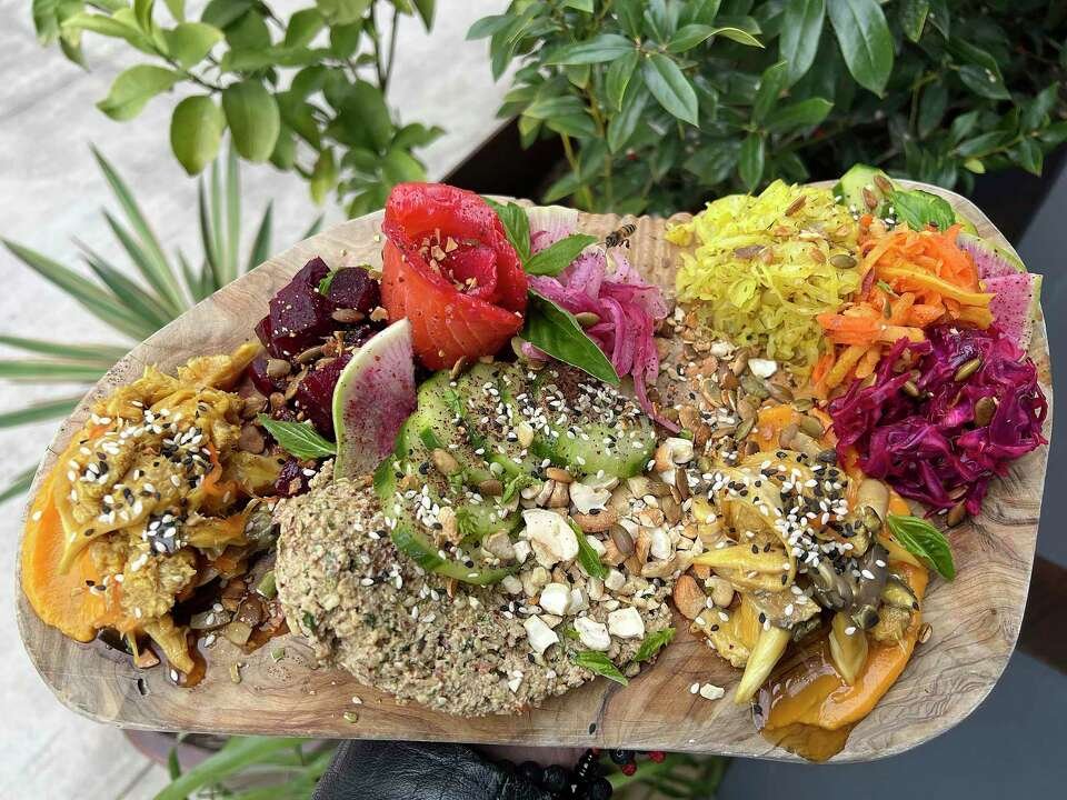 A colorful farm-to-table health board of vegetables, ferments and seeds at Pharm Table, San Antonio