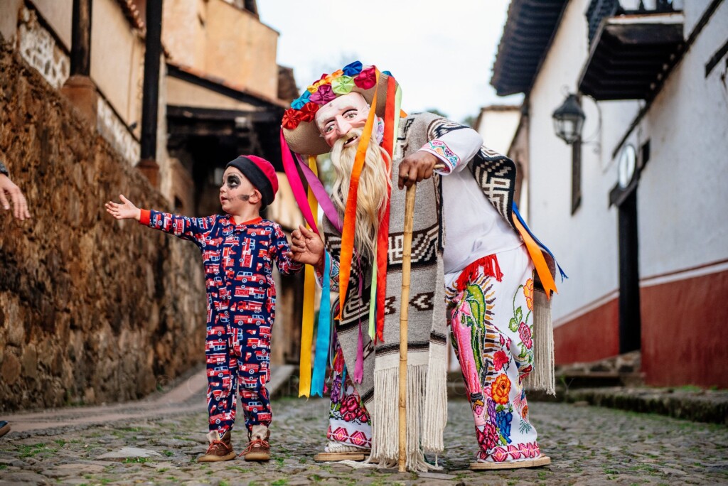 Women in Catrina face paint and traditional dress gathered in Pátzcuaro for Día de Muertos