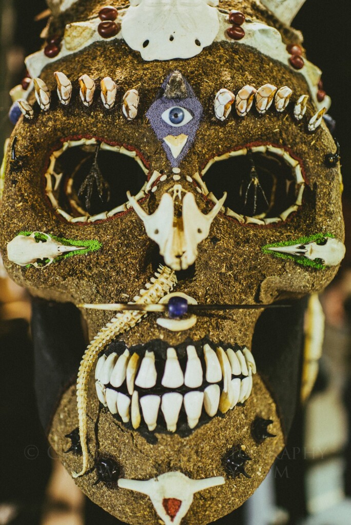 Decorated skull artwork with teeth and shells displayed for Día de Muertos in San Miguel de Allende